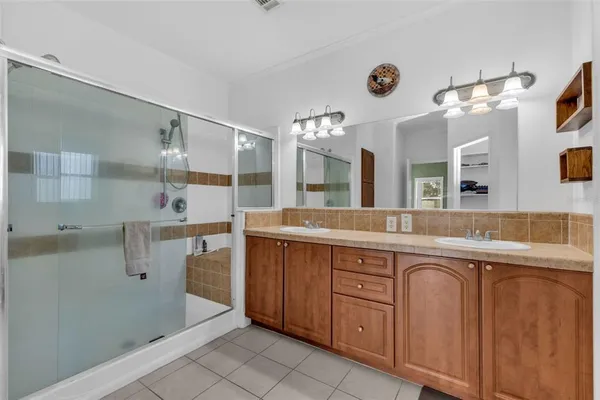 a bathroom with a tub sink and a mirror