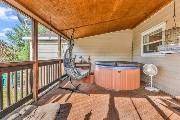 a view of a porch with wooden floor