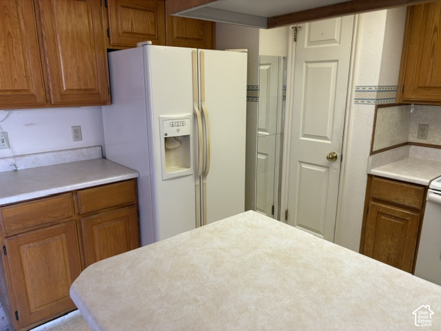 2164 West 2000 North St. George, UT 84770 - Photo 9 of 26 Lots of counterspace and a white fridge with an icemaker