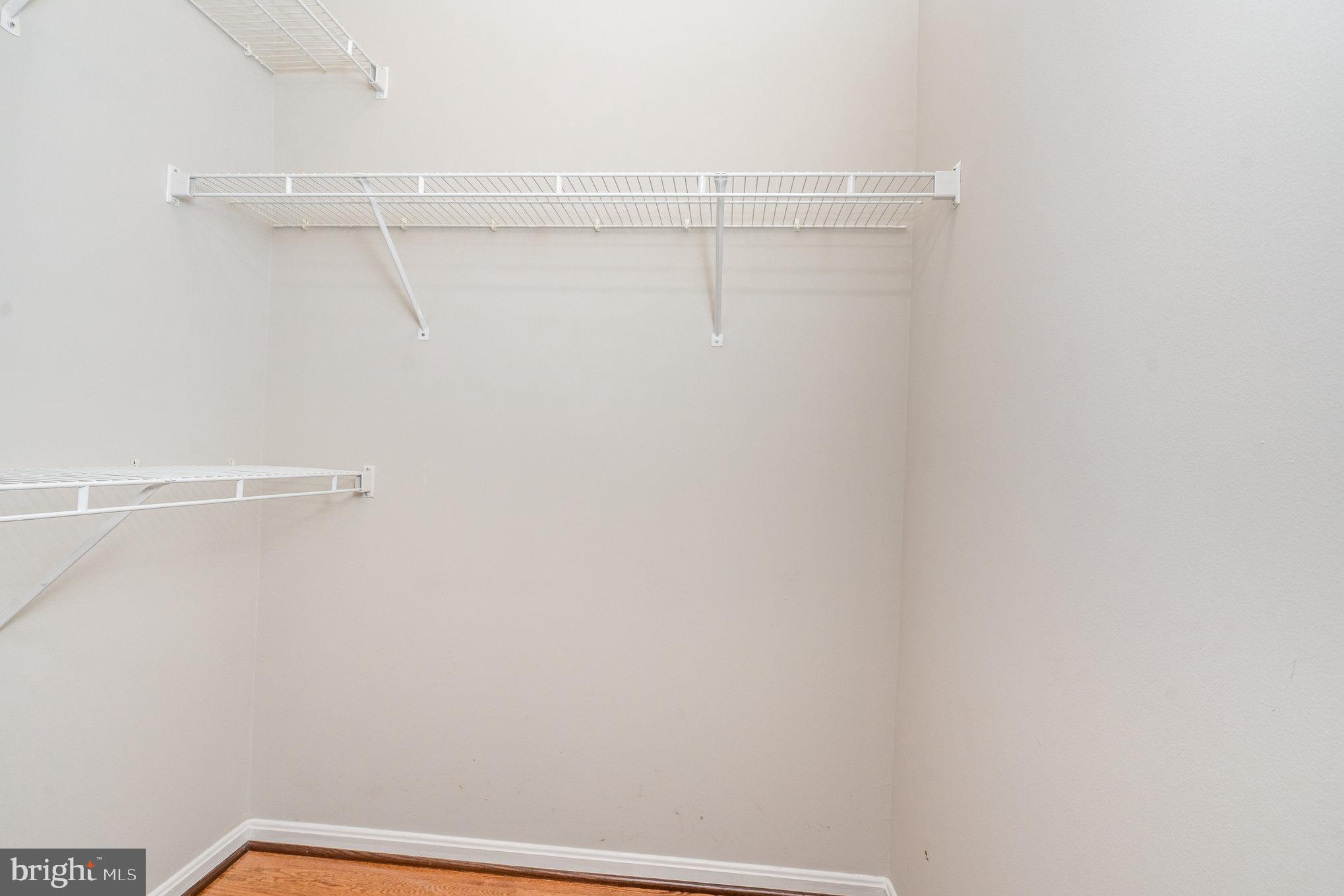 4850 Eisenhower Avenue, Unit 203 Alexandria, VA 22304 - Photo 12 of 24 a view of a room with racks on the wall
