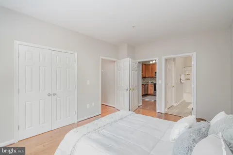 a bedroom with a bed and closet