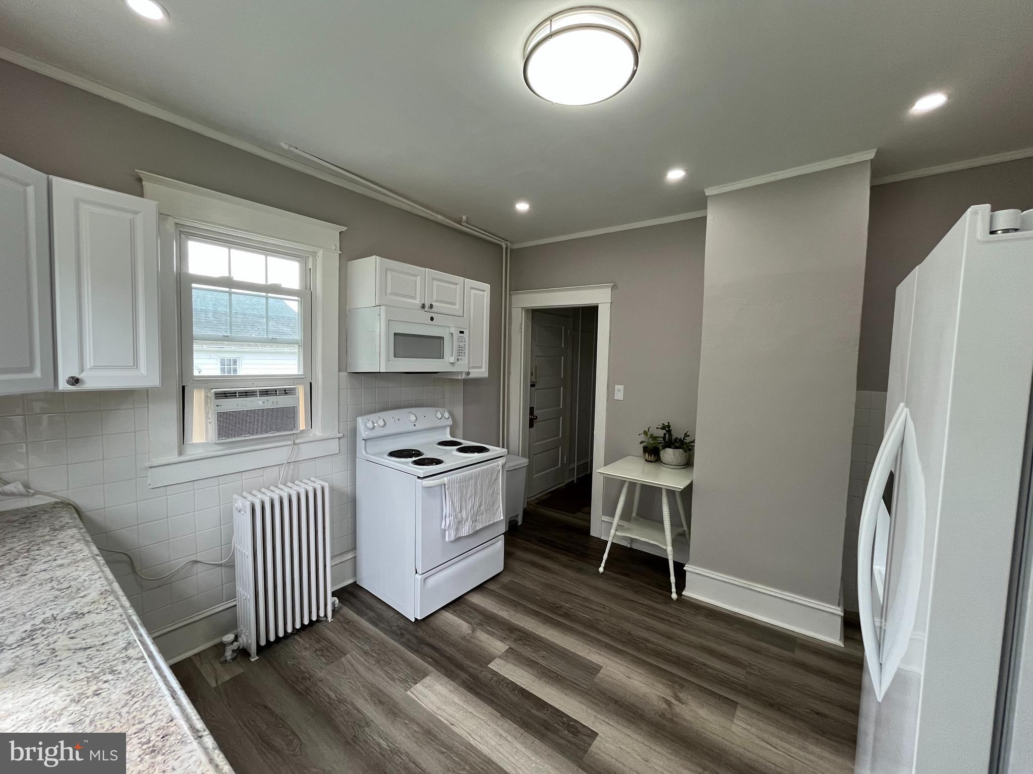 500 Delaware Avenue Delmar, DE 19940 - Photo 12 of 29 a kitchen with stainless steel appliances granite countertop a refrigerator and a stove