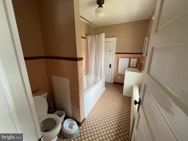 a bathroom with a sink and toilet