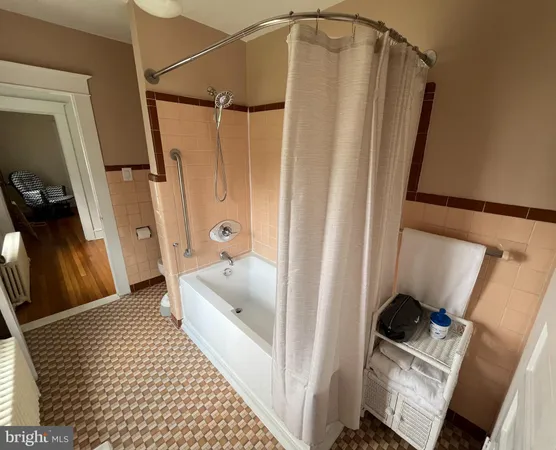 a bathroom with a sink a mirror and shower