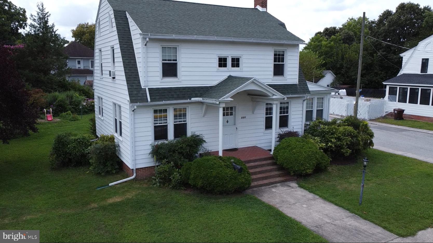 500 Delaware Avenue Delmar, DE 19940 - Photo 27 of 29 a front view of a house with a garden