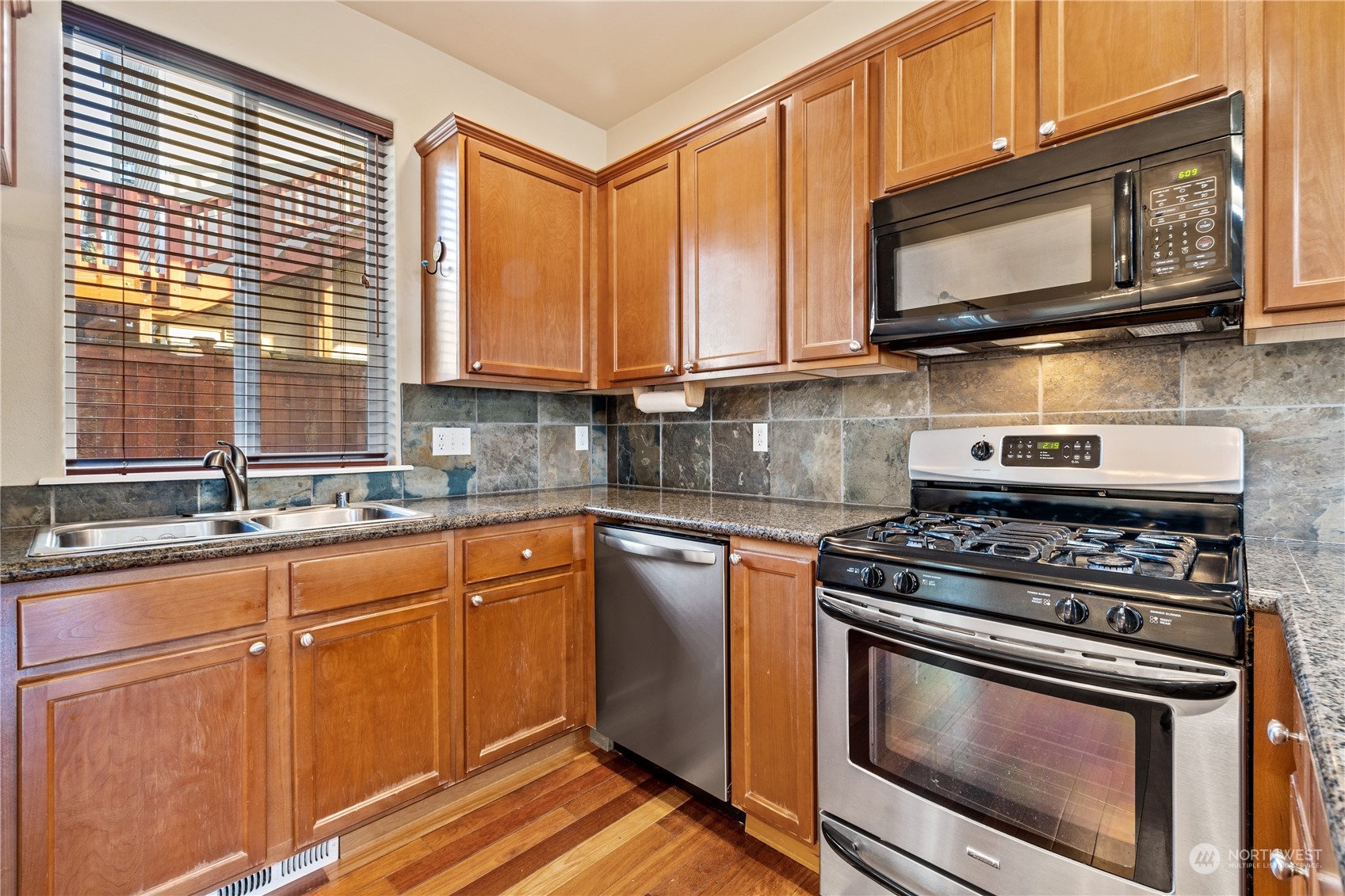 24041 40th Lane Southeast Bothell, WA 98021 - Photo 12 of 29 a kitchen with granite countertop cabinets stainless steel appliances and a sink