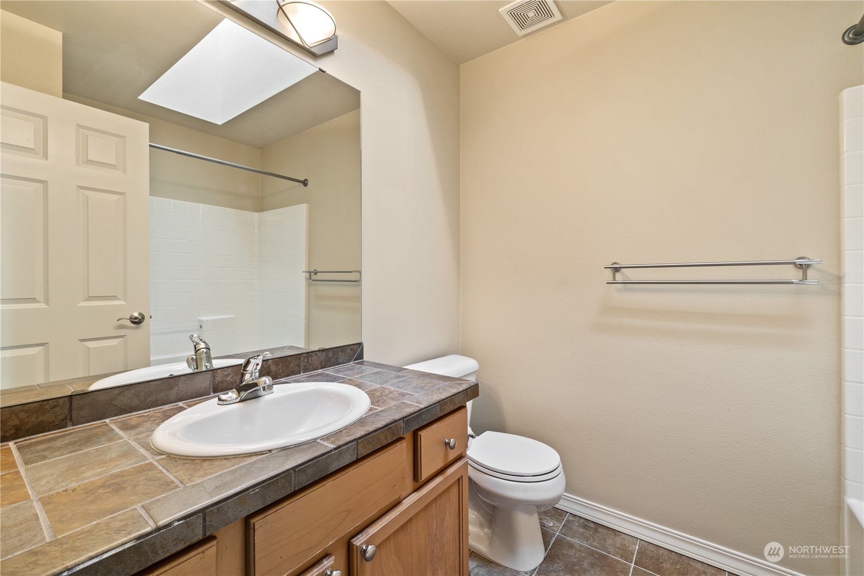 24041 40th Lane Southeast Bothell, WA 98021 - Photo 23 of 29 a bathroom with a sink toilet and a mirror