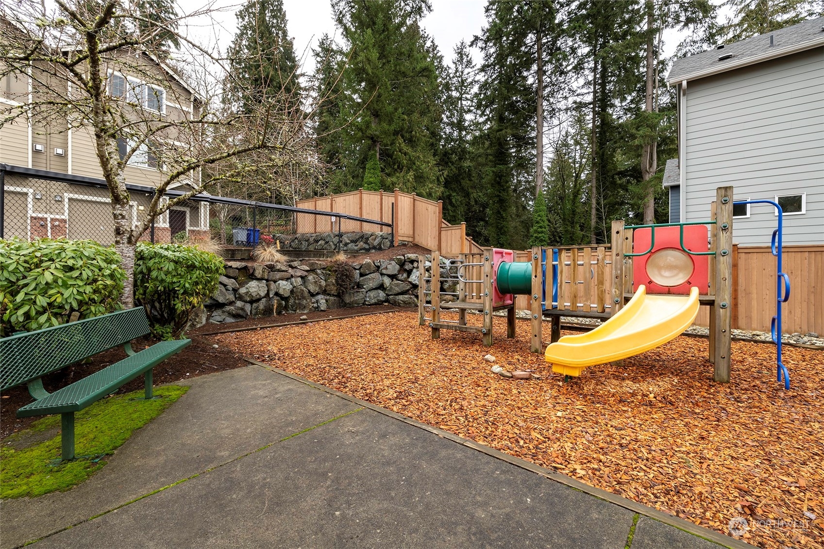 24041 40th Lane Southeast Bothell, WA 98021 - Photo 28 of 29 a view of a chair and table in backyard of the house