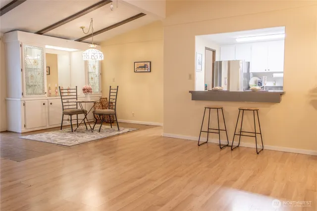 a view of a livingroom with furniture and a window