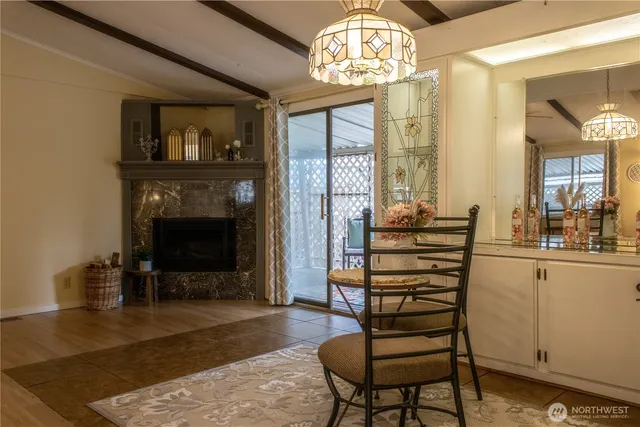 a view of a livingroom with furniture and chandelier kitchen