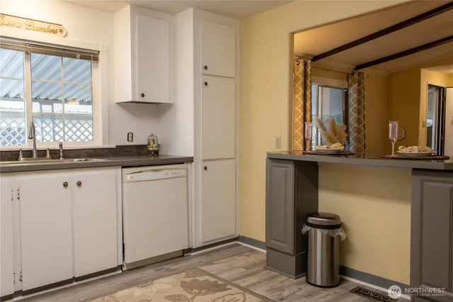 a kitchen with a sink and cabinets