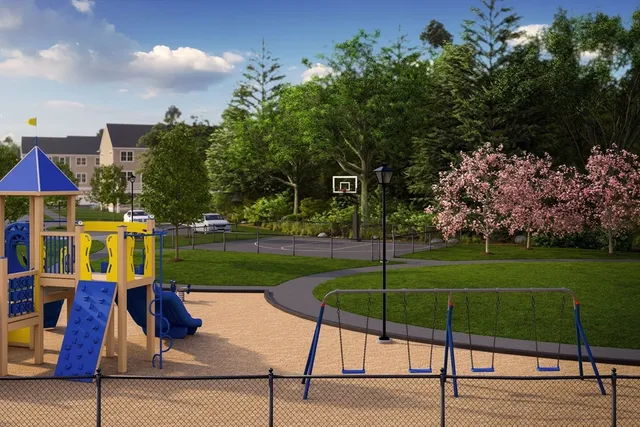 a backyard of a house with lots of green space and a lake view