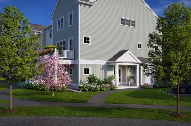a living room with furniture two window and a fireplace