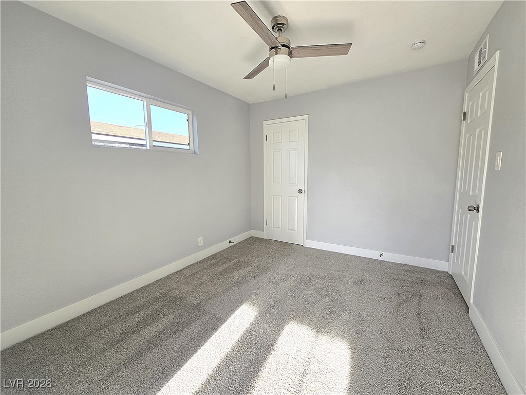 1437 Chestnut Street Henderson, NV 89011 - Photo 11 of 23 Unfurnished bedroom featuring carpet flooring and ceiling fan