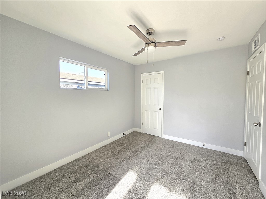 1437 Chestnut Street Henderson, NV 89011 - Photo 12 of 23 Unfurnished bedroom featuring carpet floors and a ceiling fan