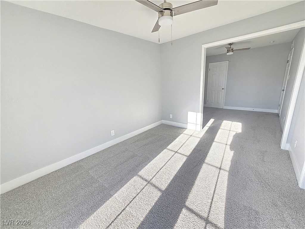 1437 Chestnut Street Henderson, NV 89011 - Photo 16 of 23 Unfurnished room with light colored carpet and a ceiling fan