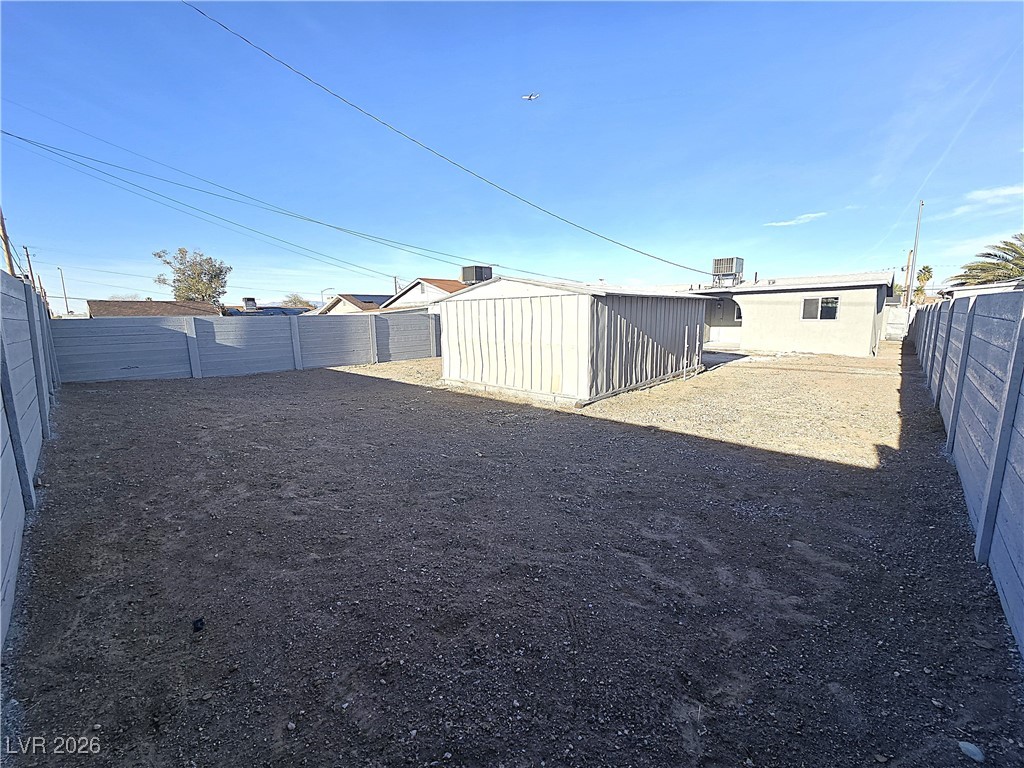 1437 Chestnut Street Henderson, NV 89011 - Photo 20 of 23 Fenced backyard featuring a shed