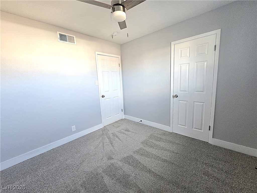 1437 Chestnut Street Henderson, NV 89011 - Photo 9 of 23 Unfurnished bedroom with carpet and ceiling fan