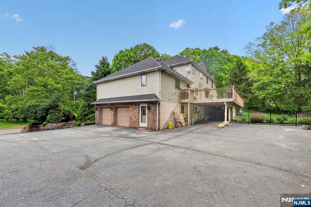 5110 Berkshire Valley Road Oak Ridge, NJ 07438 - Photo 46 of 49 a front view of a house with a garage