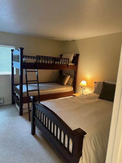 101 Shell Road, Unit 106 Watsonville, CA 95076 - Photo 16 of 16 a bedroom with bed and a night stand