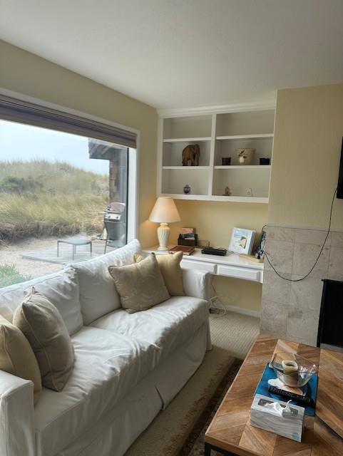101 Shell Road, Unit 106 Watsonville, CA 95076 - Photo 10 of 16 a living room with furniture and a large window