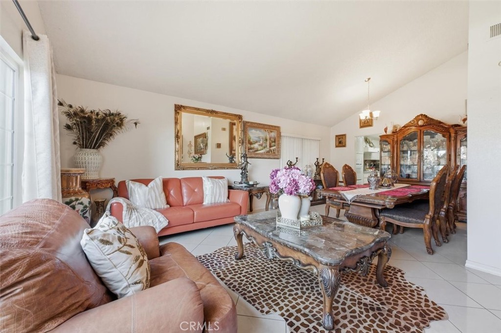 6266 Shaker Drive Riverside, CA 92506 - Photo 9 of 72 a living room with furniture a rug and a table