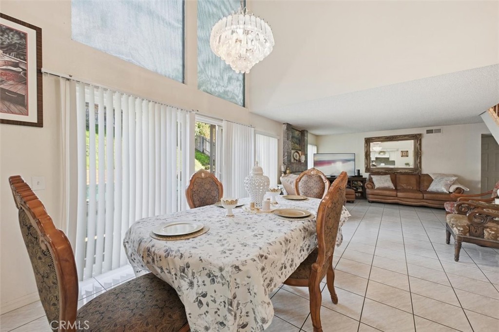 6266 Shaker Drive Riverside, CA 92506 - Photo 21 of 72 a view of a dining room with furniture and chandelier