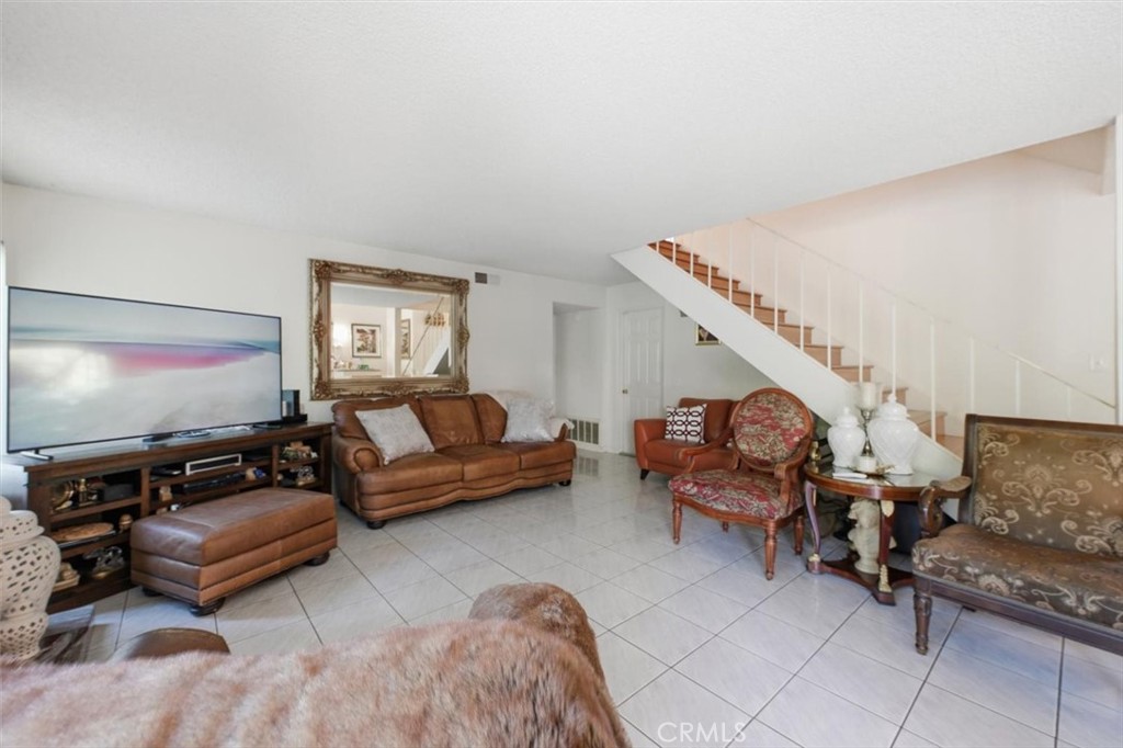 6266 Shaker Drive Riverside, CA 92506 - Photo 22 of 72 a living room with furniture and a flat screen tv