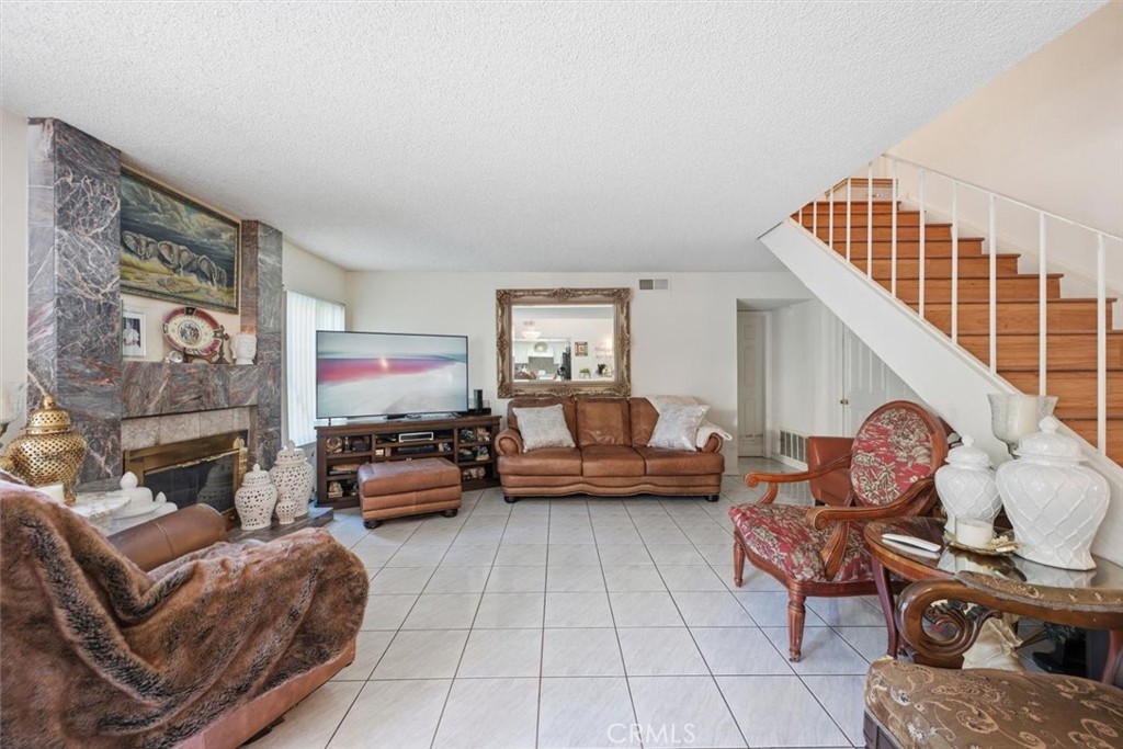 6266 Shaker Drive Riverside, CA 92506 - Photo 23 of 72 a living room with furniture and a fireplace