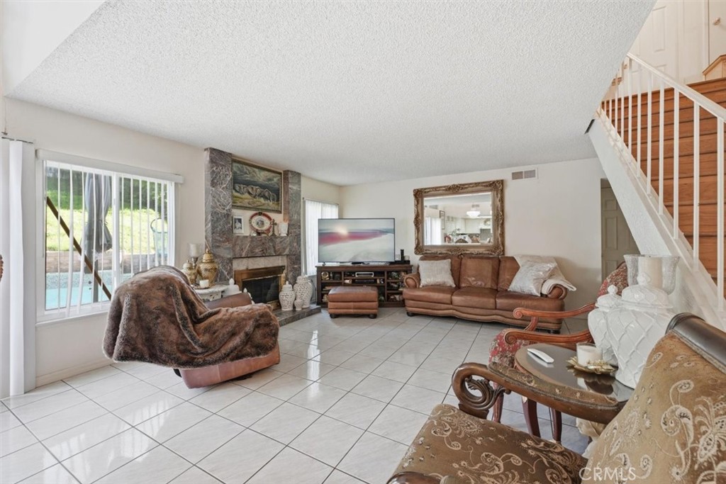 6266 Shaker Drive Riverside, CA 92506 - Photo 24 of 72 a living room with furniture ceiling fan and a window