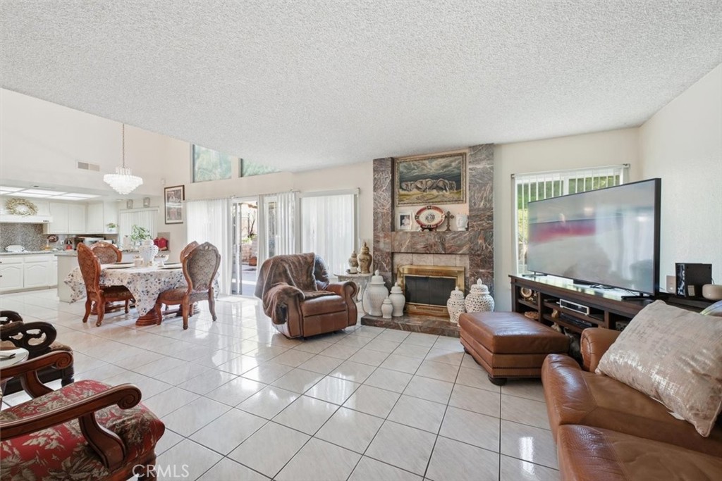 6266 Shaker Drive Riverside, CA 92506 - Photo 26 of 72 a living room with furniture and a flat screen tv