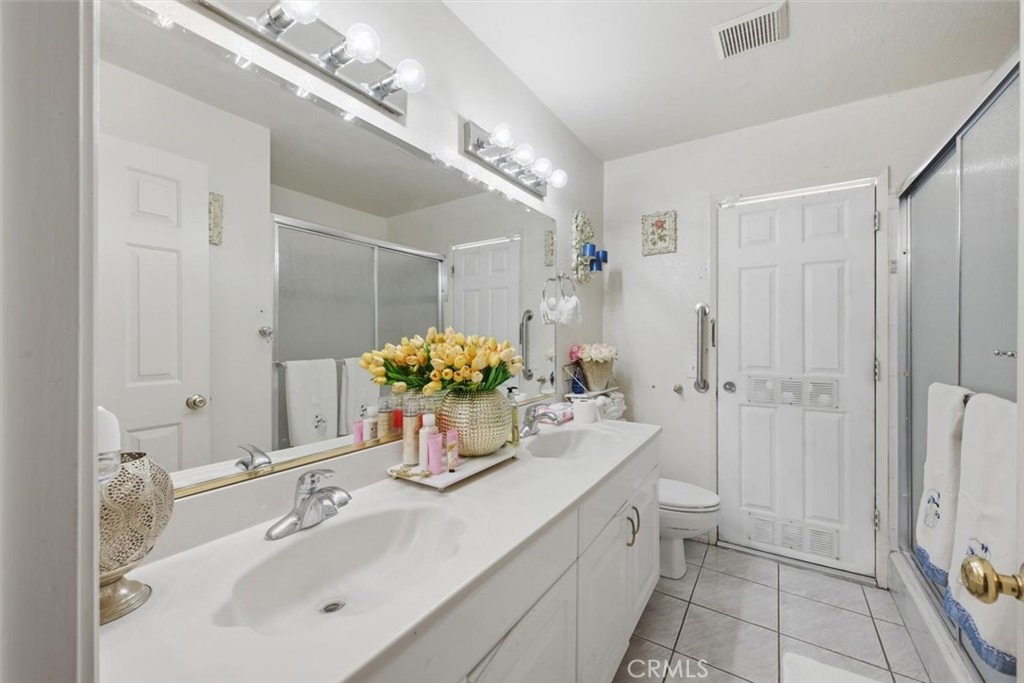 6266 Shaker Drive Riverside, CA 92506 - Photo 30 of 72 a bathroom with a sink double vanity and a mirror