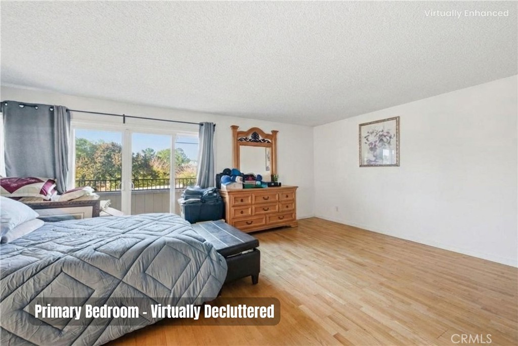 6266 Shaker Drive Riverside, CA 92506 - Photo 33 of 72 a bedroom with a bed and wooden floor