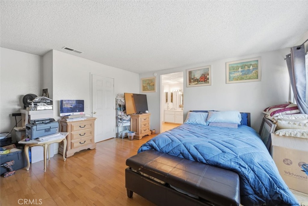 6266 Shaker Drive Riverside, CA 92506 - Photo 35 of 72 a bedroom with a bed and furniture