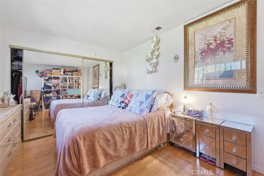 6266 Shaker Drive Riverside, CA 92506 - Photo 39 of 72 a bedroom with a bed and a dresser