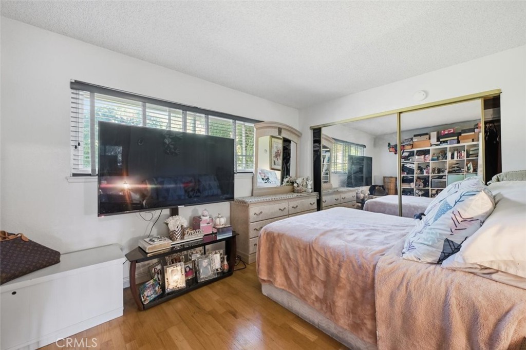 6266 Shaker Drive Riverside, CA 92506 - Photo 40 of 72 a bedroom with a bed and a flat screen tv