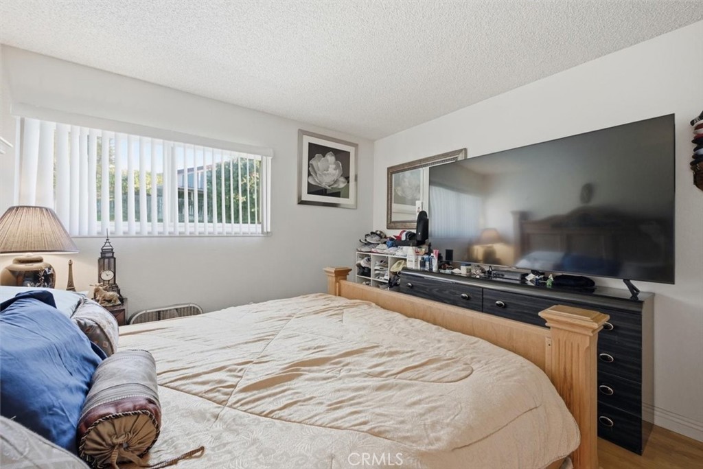 6266 Shaker Drive Riverside, CA 92506 - Photo 42 of 72 a bedroom with a bed and a flat screen tv