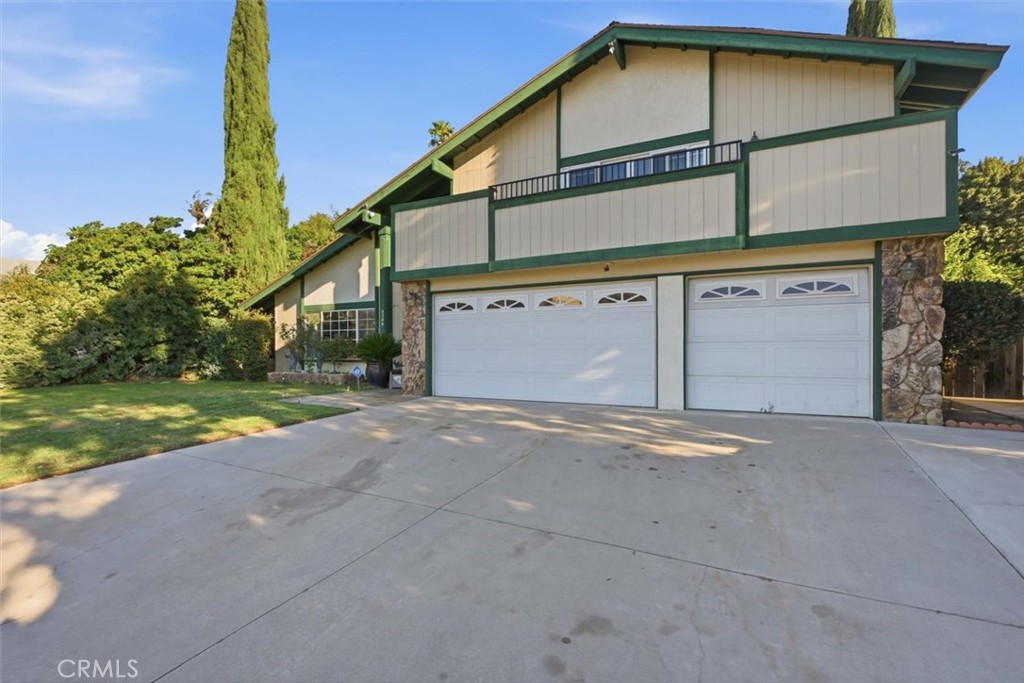6266 Shaker Drive Riverside, CA 92506 - Photo 61 of 72 a view of a house with a yard and garage