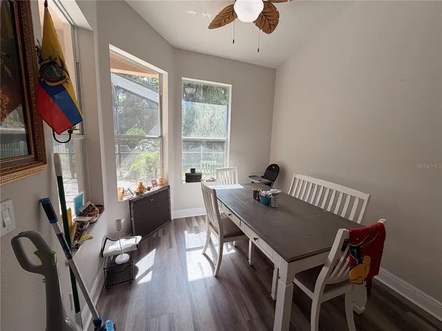 a view of a dining room with furniture window and outside view