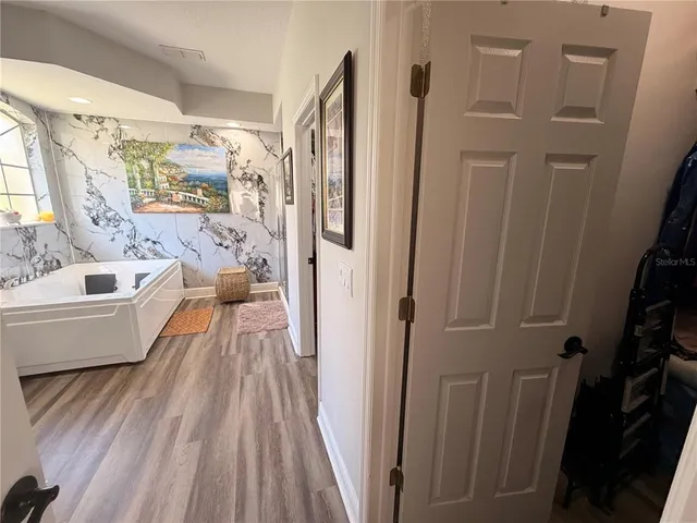 a bathroom with a bathtub a toilet and a shower