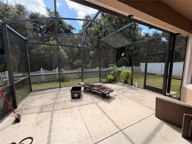 a view of backyard with wheel chair and potted plants