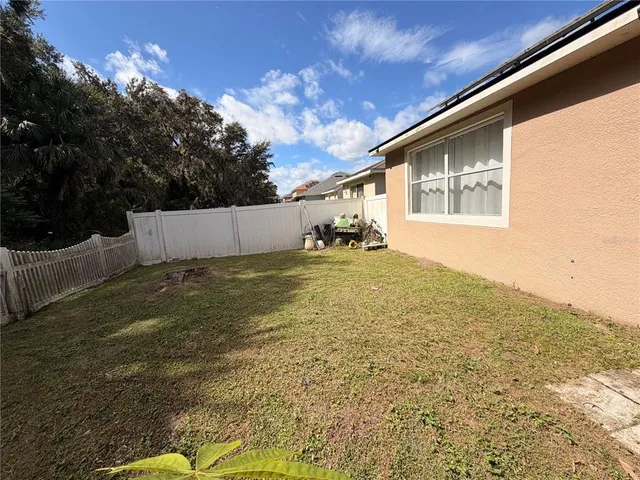 a view of a backyard of the house