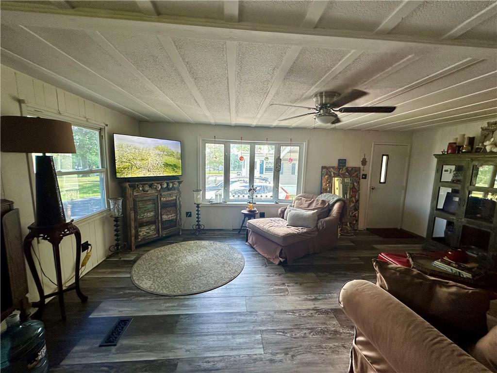 381 Red Oak Lane Bath, PA 18014 - Photo 21 of 27 Natural light floods this inviting living space, highlighting its durable flooring and modern ceiling fan.