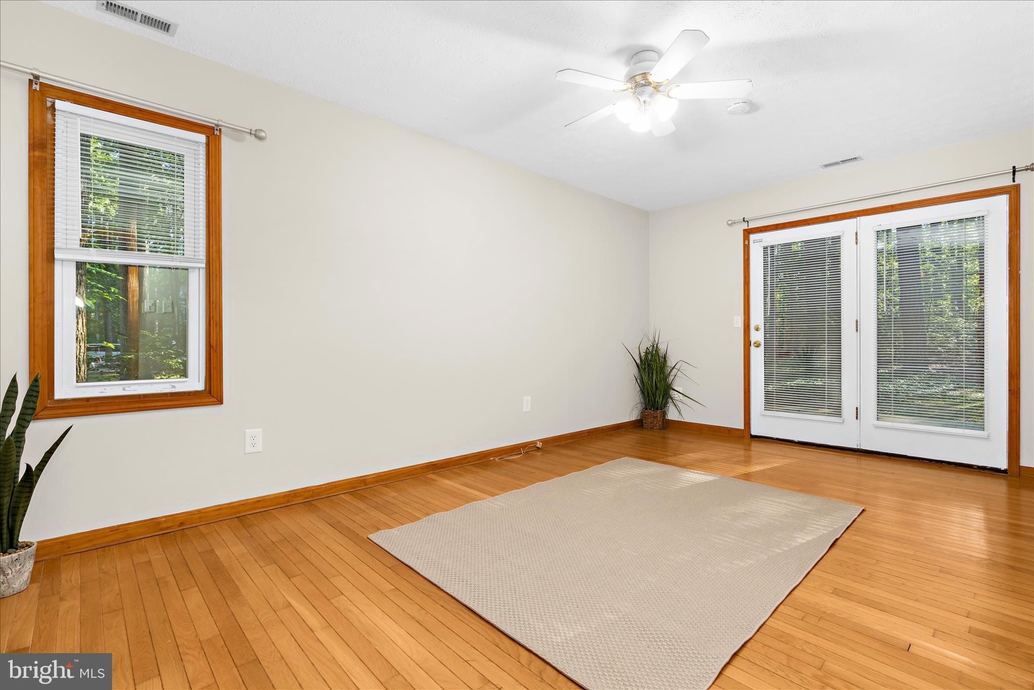 318 Wicomico Road Stevensville, MD 21666 - Photo 23 of 51 Primary bedroom with access to deck BR #1