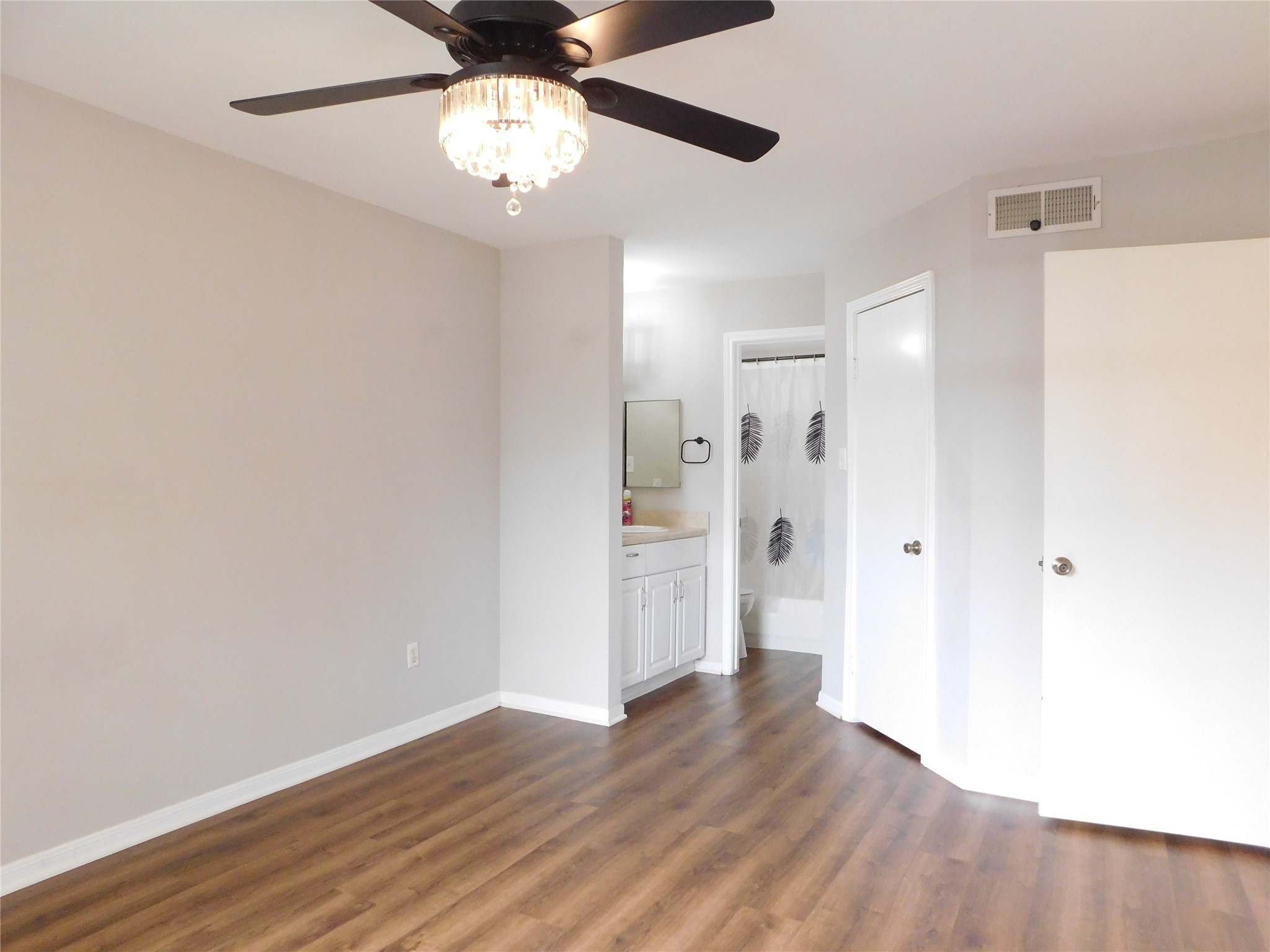 10101 South Gessner Road, Unit 912 Houston, TX 77071 - Photo 18 of 47 a view of an empty room with wooden floor