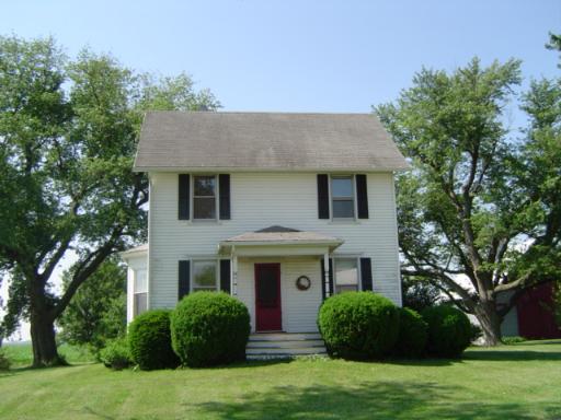 10816 Watson Road Waterman, IL 60556 - Photo 1 of 1 a front view of a house with a garden