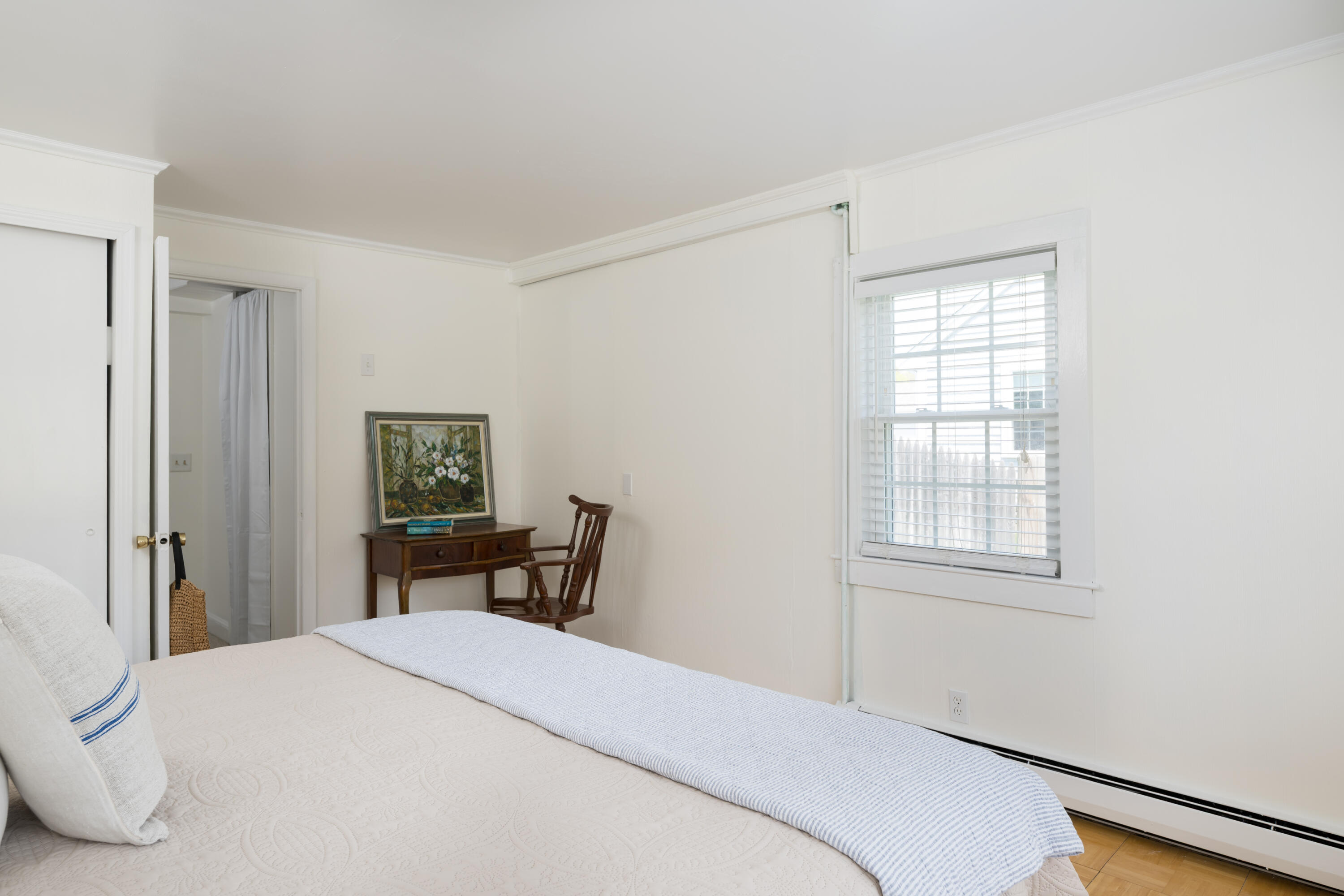 111 Lewis Road West Yarmouth, MA 02673 - Photo 21 of 43 a bedroom with a bed and a table in it with window