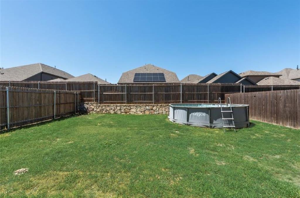 3911 Rochelle Lane Crandall, TX 75114 - Photo 16 of 16 a view of a house with backyard and sitting area