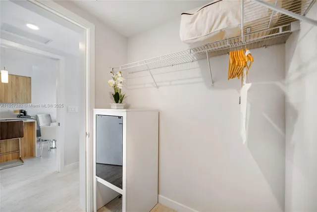 a view of walk in closet with window