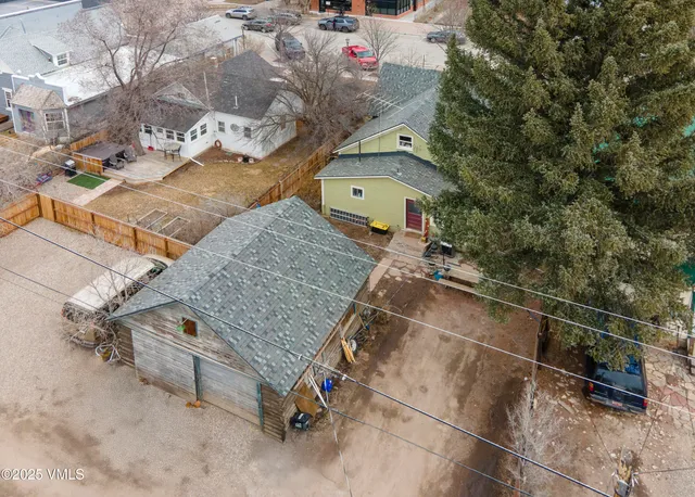 a view of a house with a wooden deck